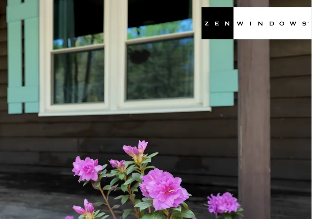 Flowers in front of a clean window with the Zen Windows Carolina logo superimposed