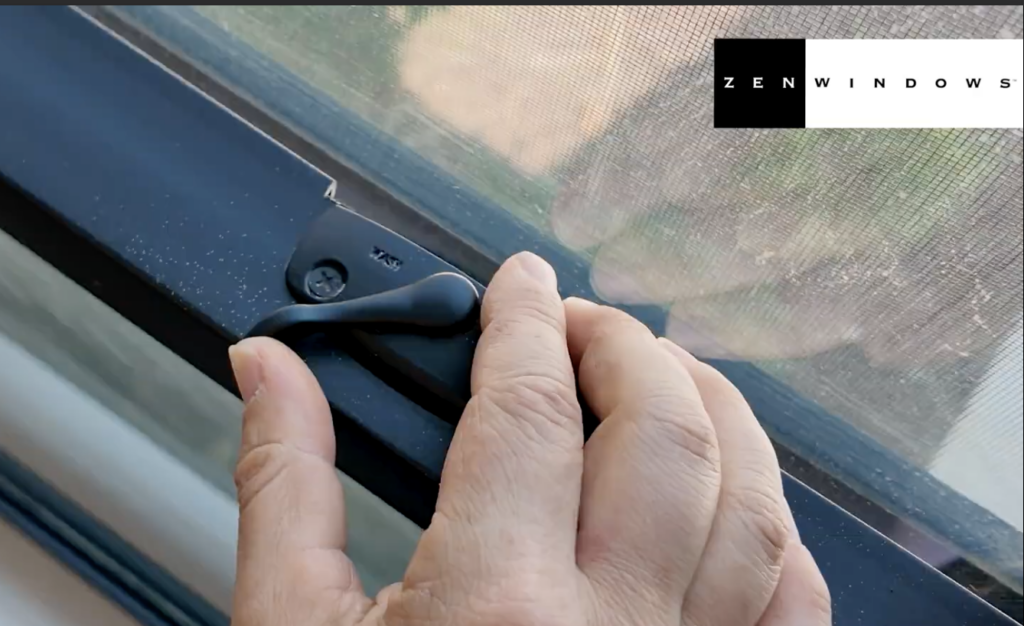 Someone unlocking a window