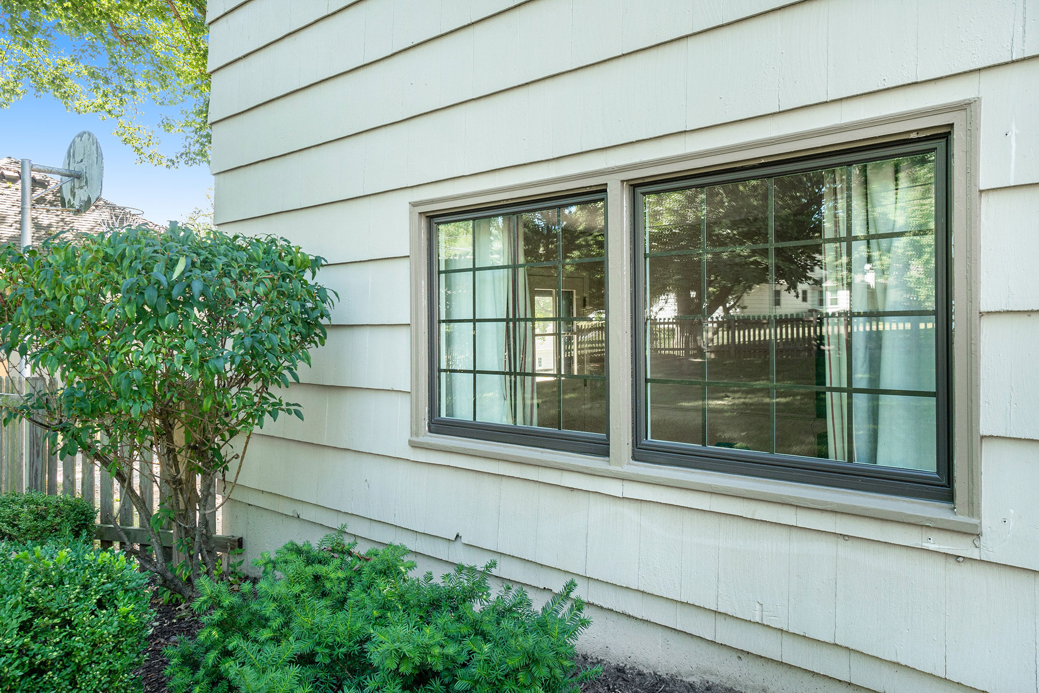 Black picture windows with grids.