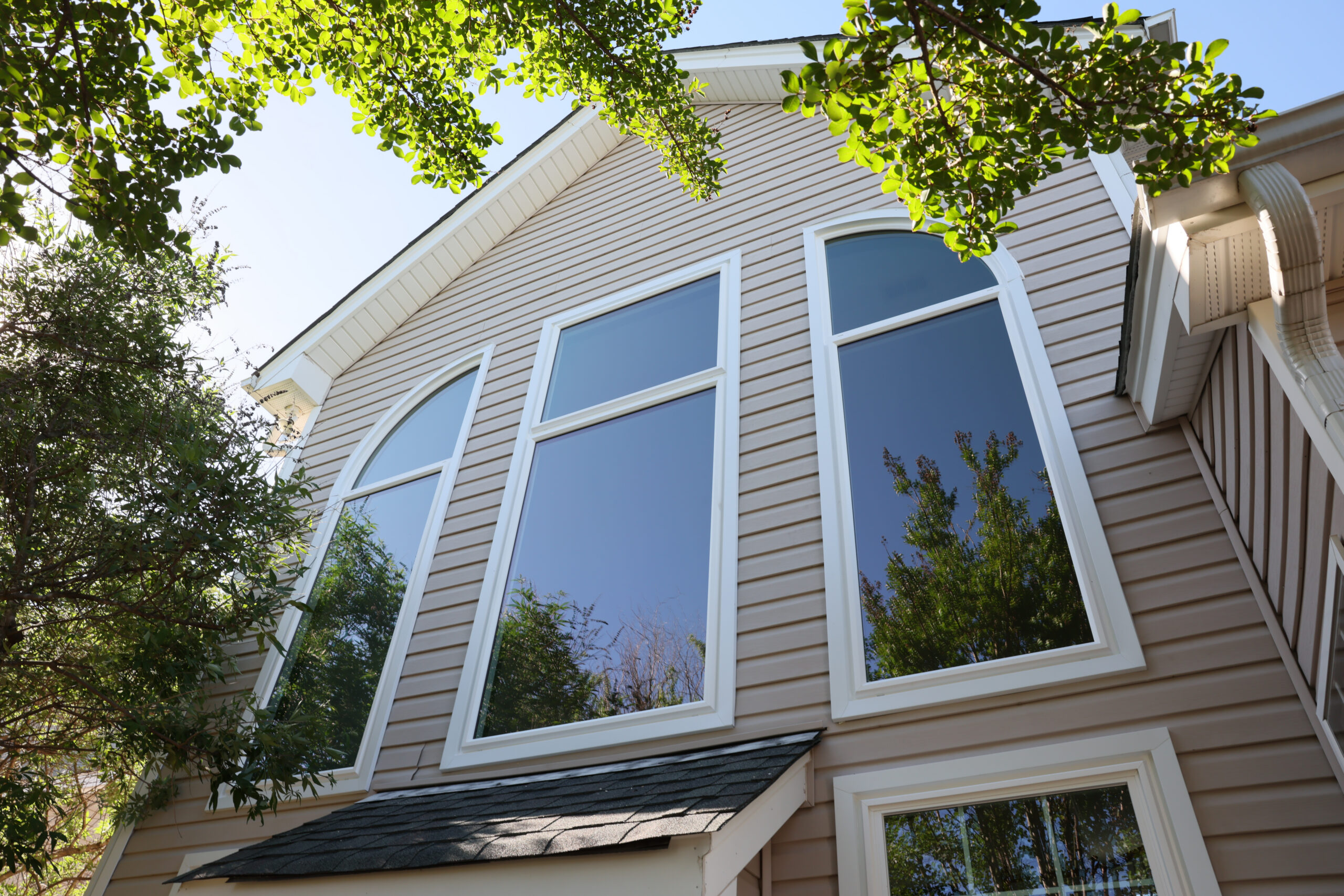 Three large picture windows with specialty windows.