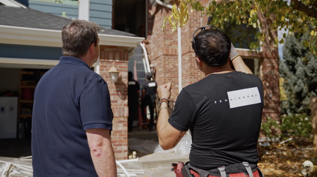Homeowner talking to a Zen Windows employee about the installation process.