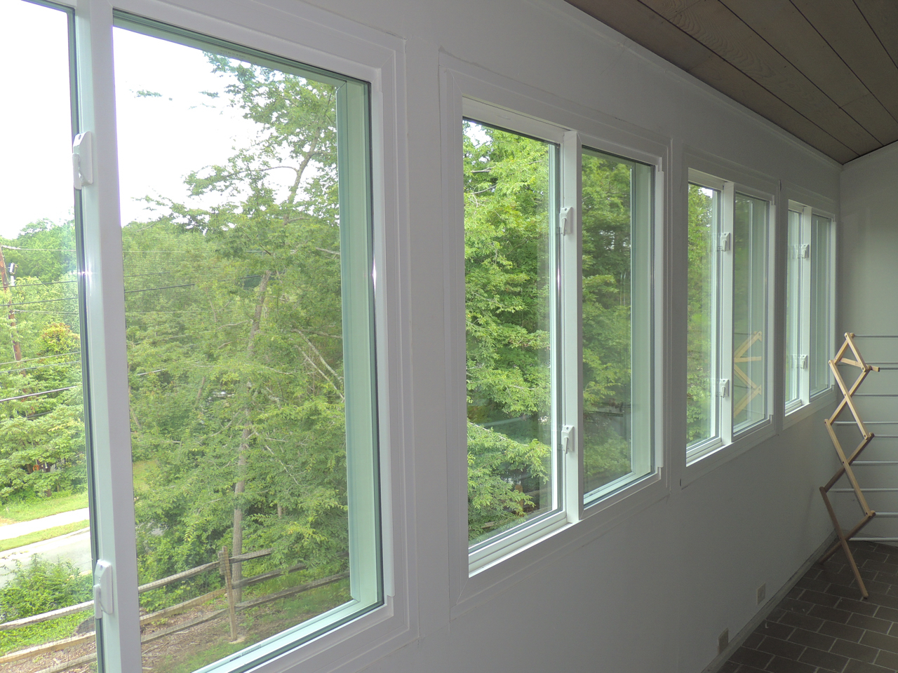 Double sliding windows with view of trees.