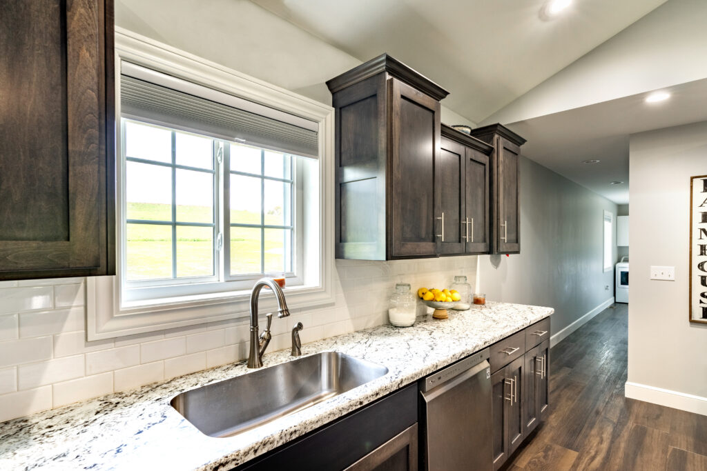 White Endure sliding window above kitchen sink.