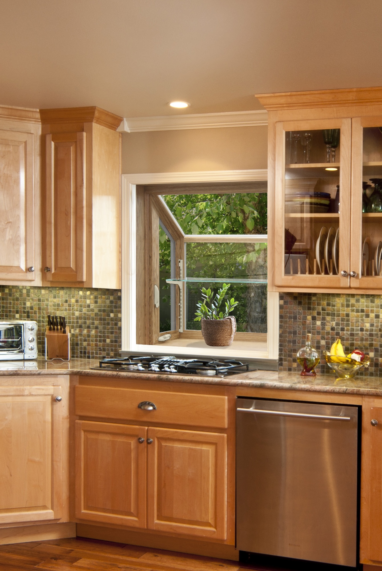 Garden window over kitchen sink with plant.