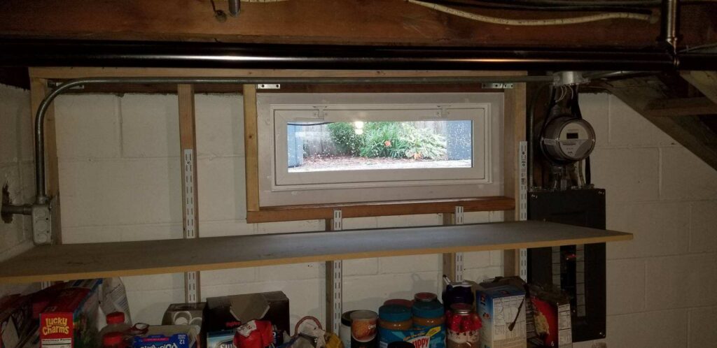 Hopper window in basement.