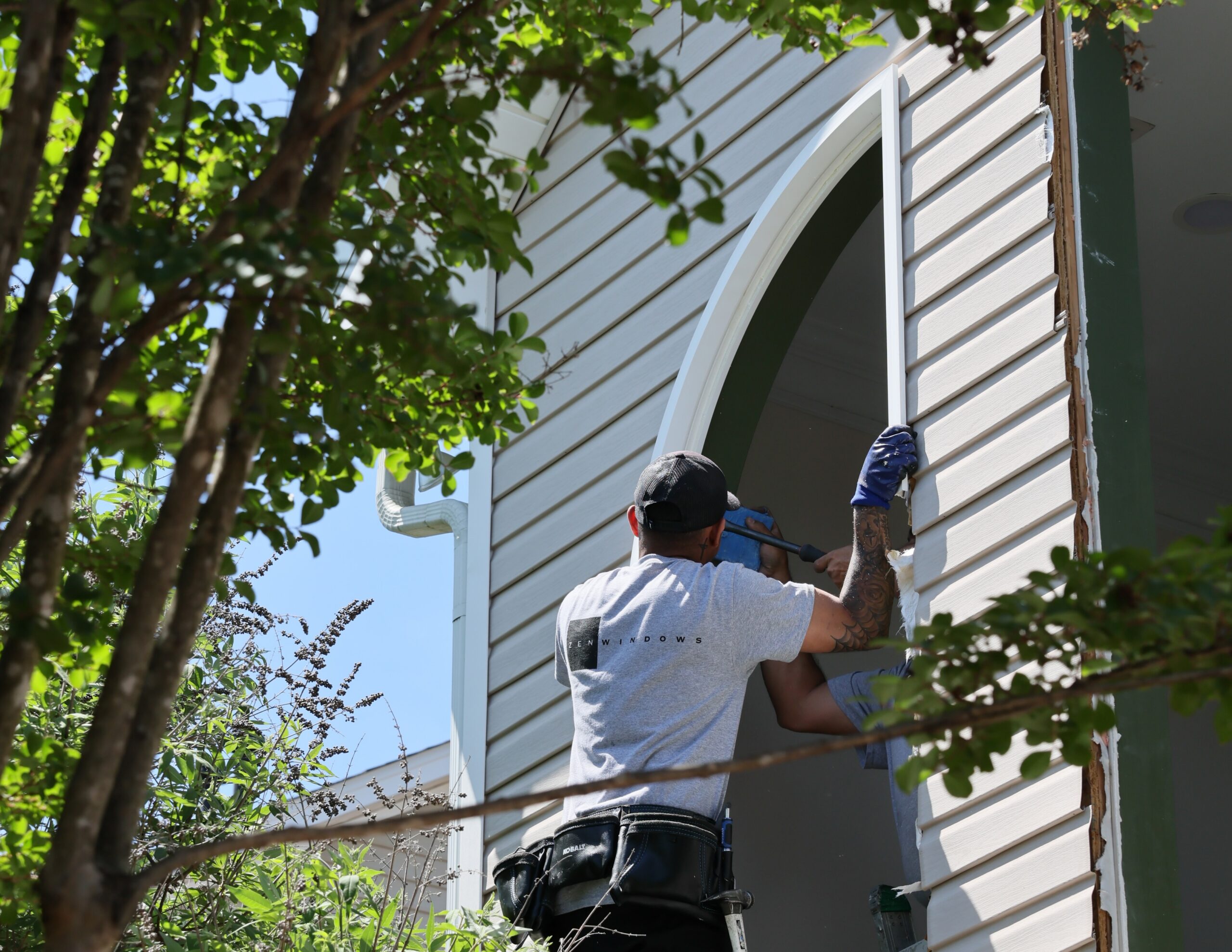 Taking out the old frame of a window.