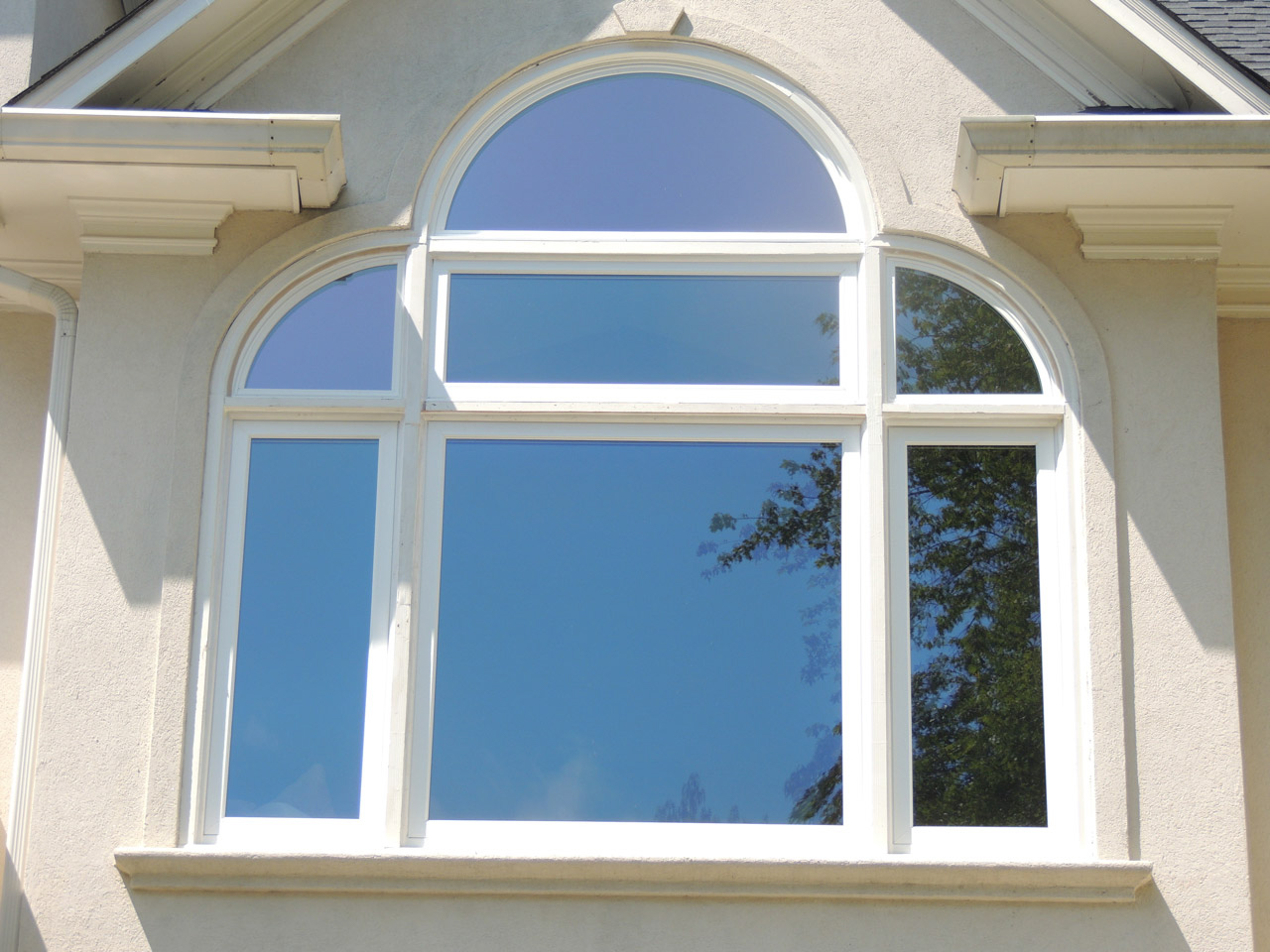 Two quarter-rounds and one half-round window.