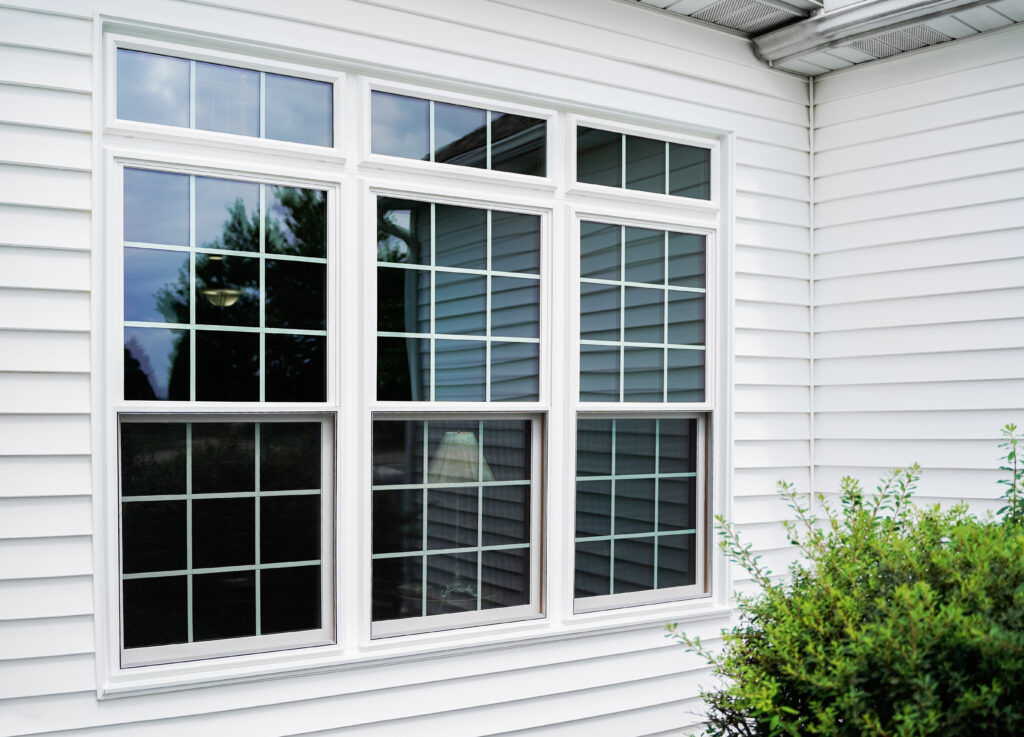 Endure double-hung window in white with grids.