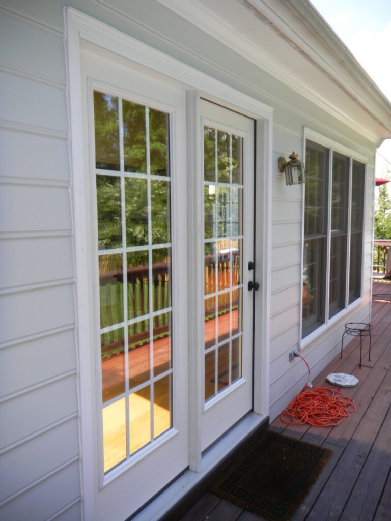 Hinged patio door with colonial grids.