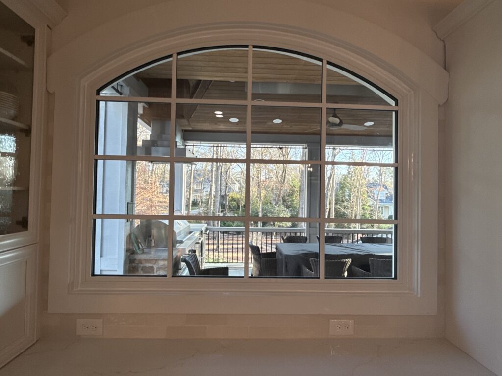 Round top window with grids.