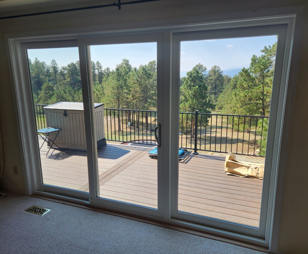 Interior view of triple panel sliding glass door.
