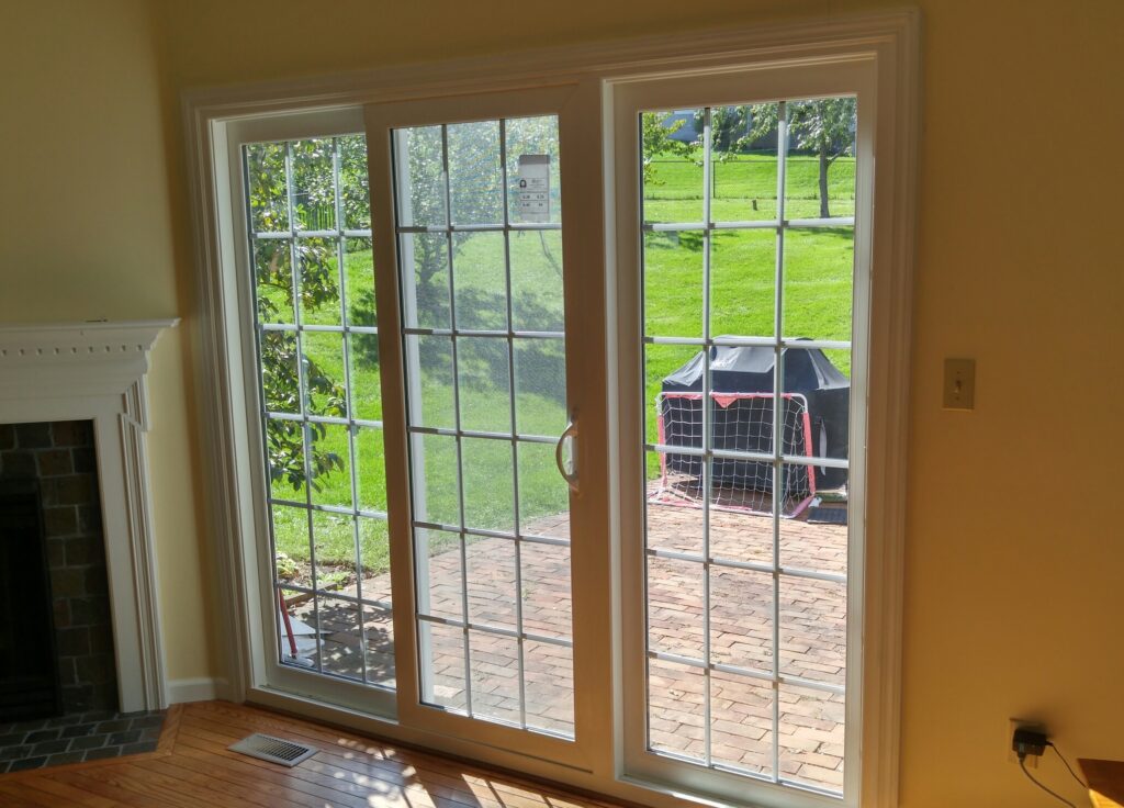 Triple sliding glass door with cottage grids.