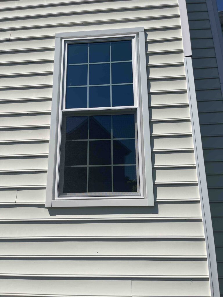 White double hung window with grids.