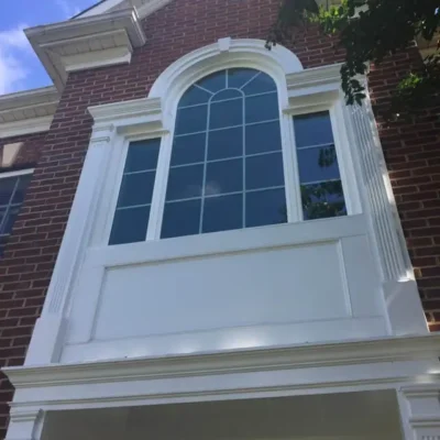 professional window installers working on residential home
