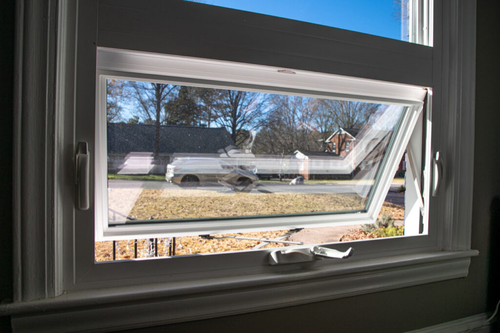 White awning window that is open.