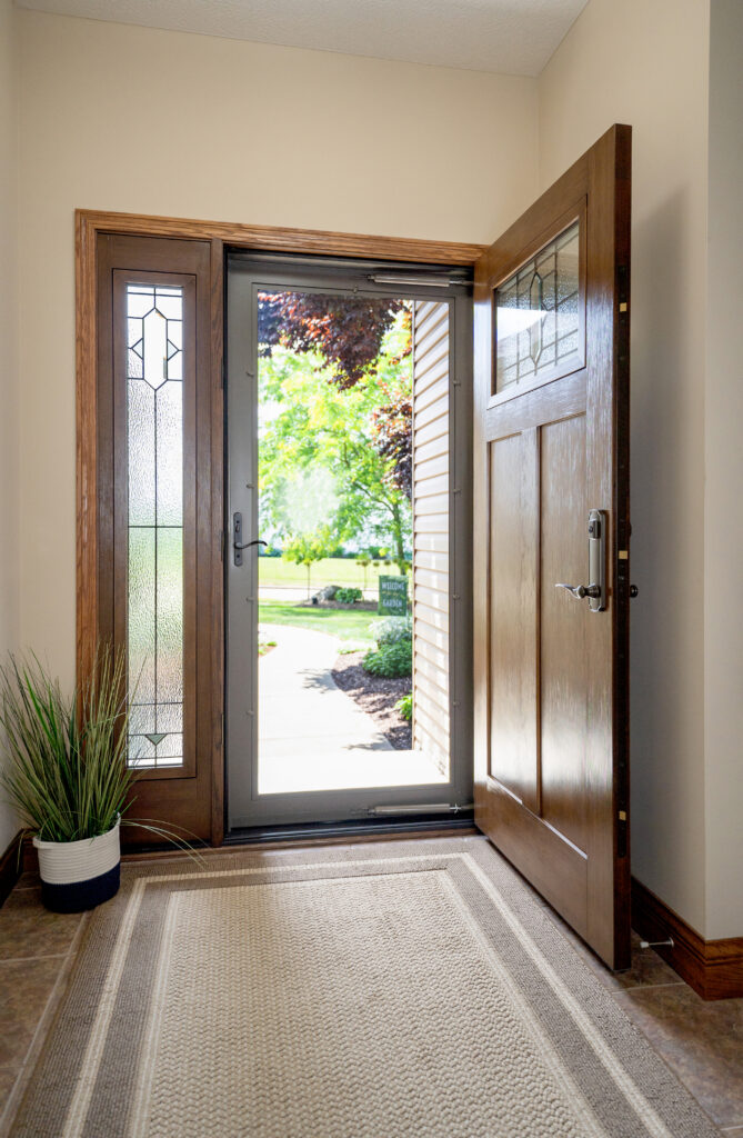 Open entry door with etched glass side-lites.