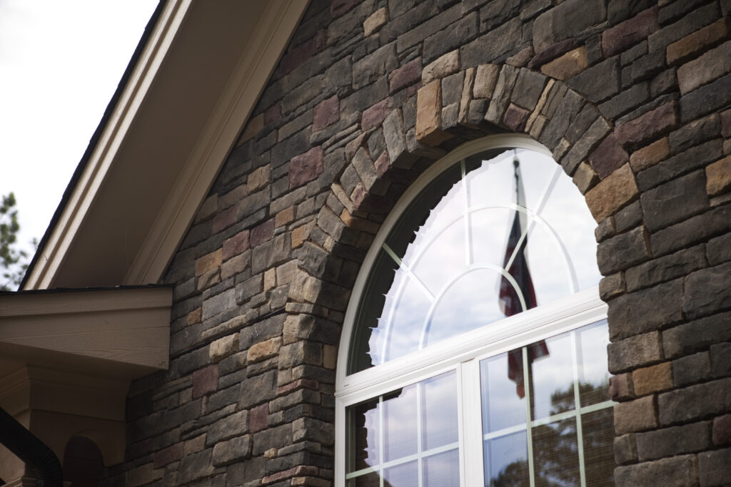 Round top window with sunburst grids.