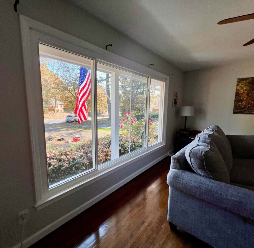 Interior view of white 3-lite sliding windows.