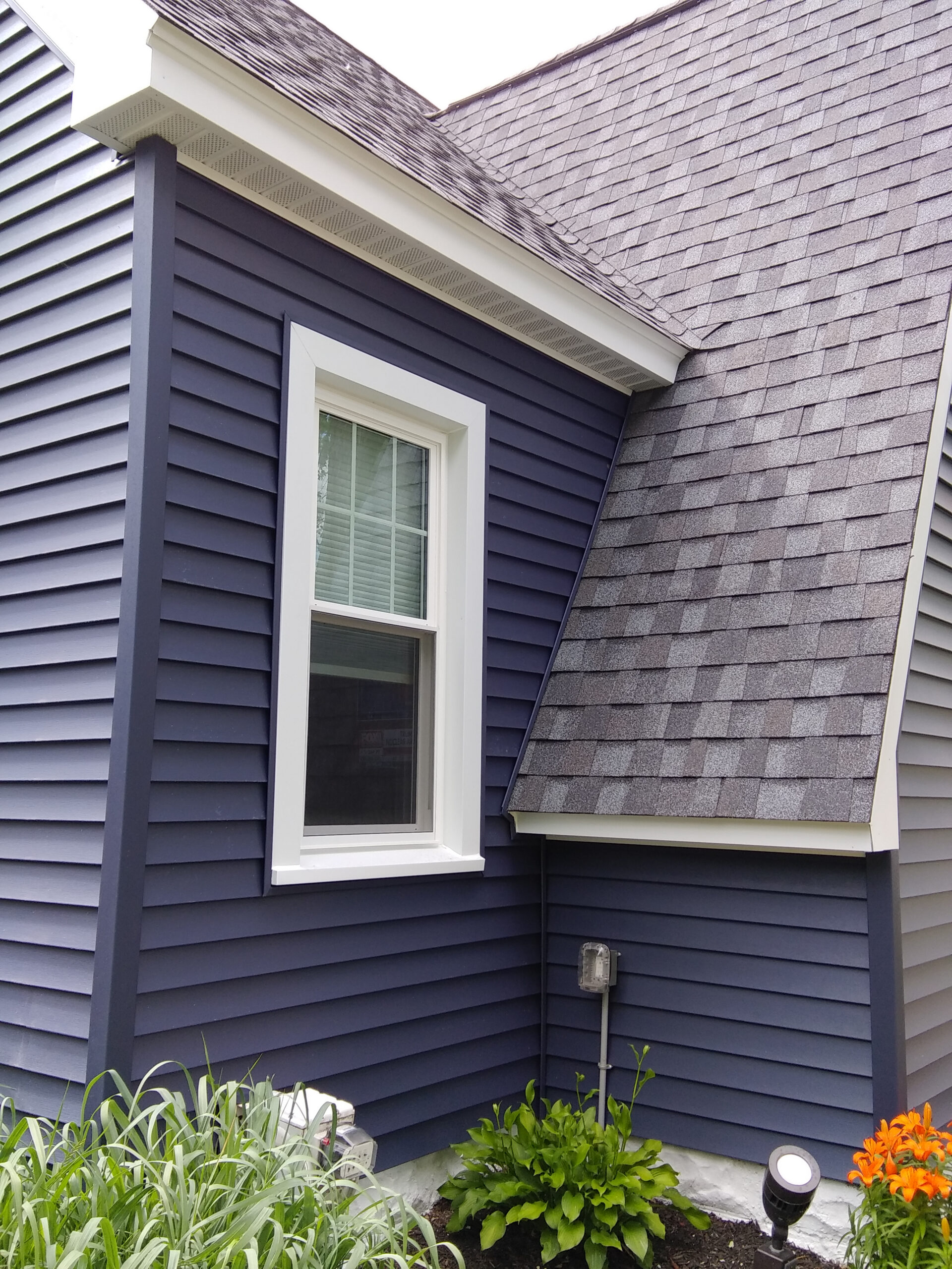 Double-hung window with top grids only.