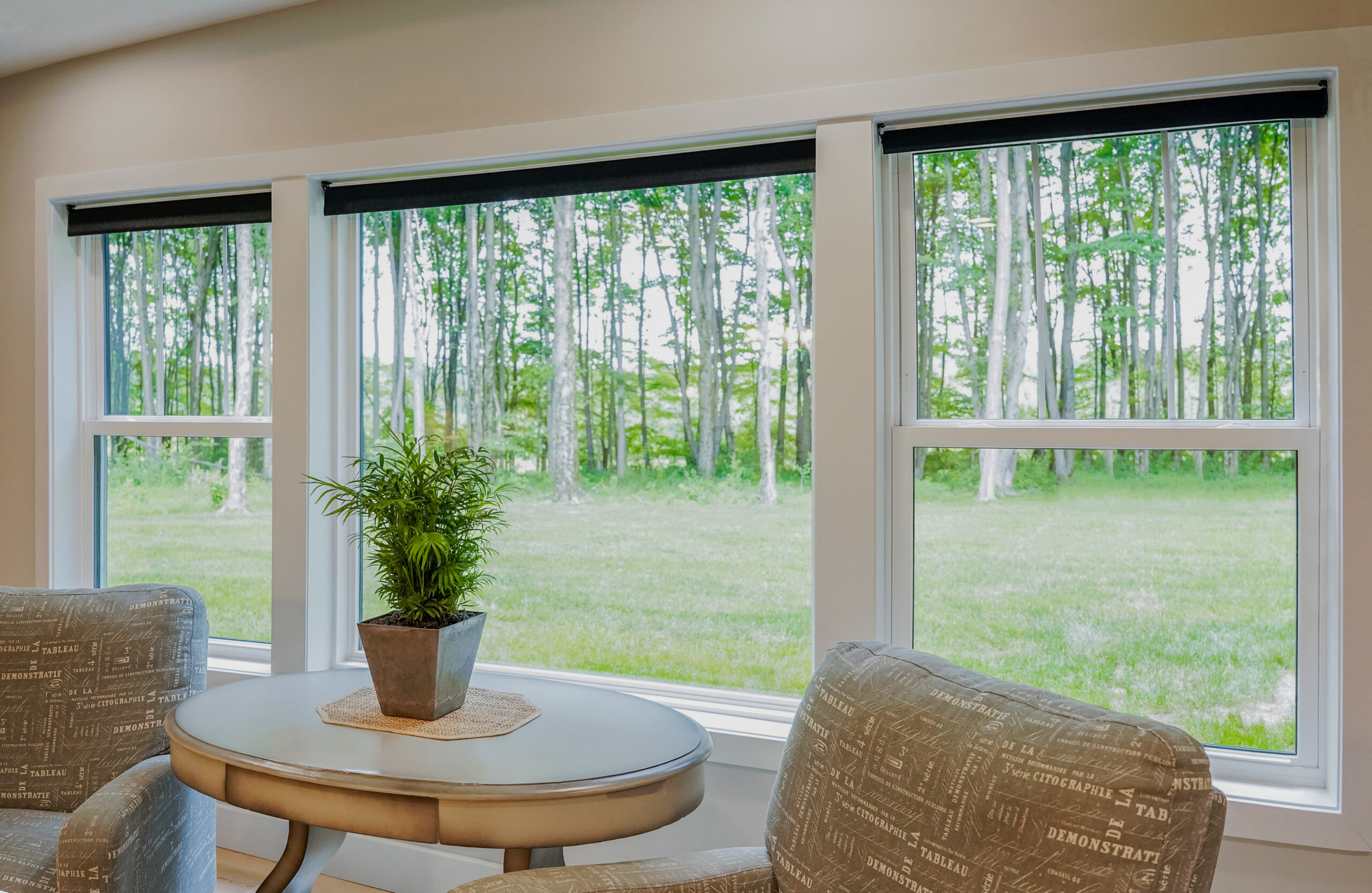 White picture window between two double-hung windows.