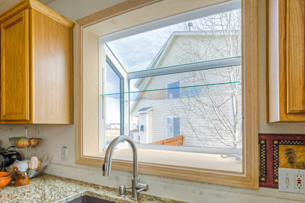 White garden window above kitchen sink.