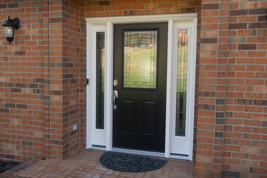 Hinged entry door with decorative glass.