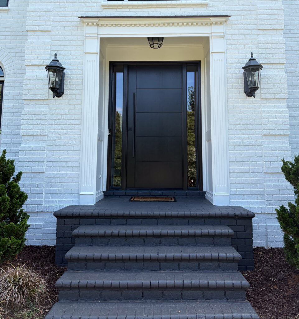 Ebony inscribed Signet fiberglass door.