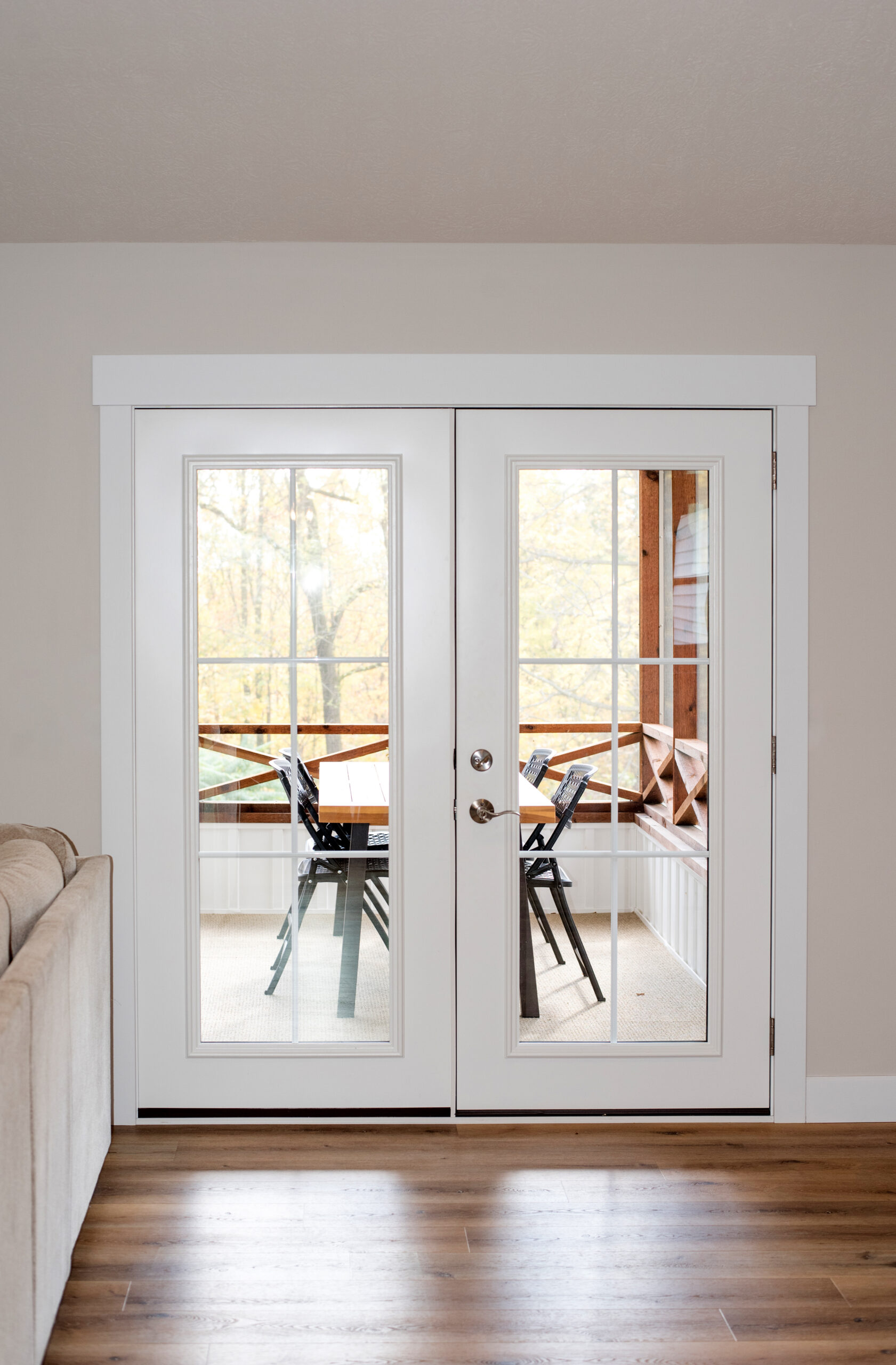 Interior view of legacy hinged patio door in snow mist white.