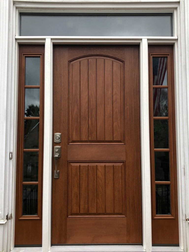 Wood-like fiberglass entry door with side lites.