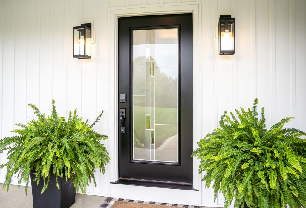 Coal black Signet entry door with Genesis decorative glass.