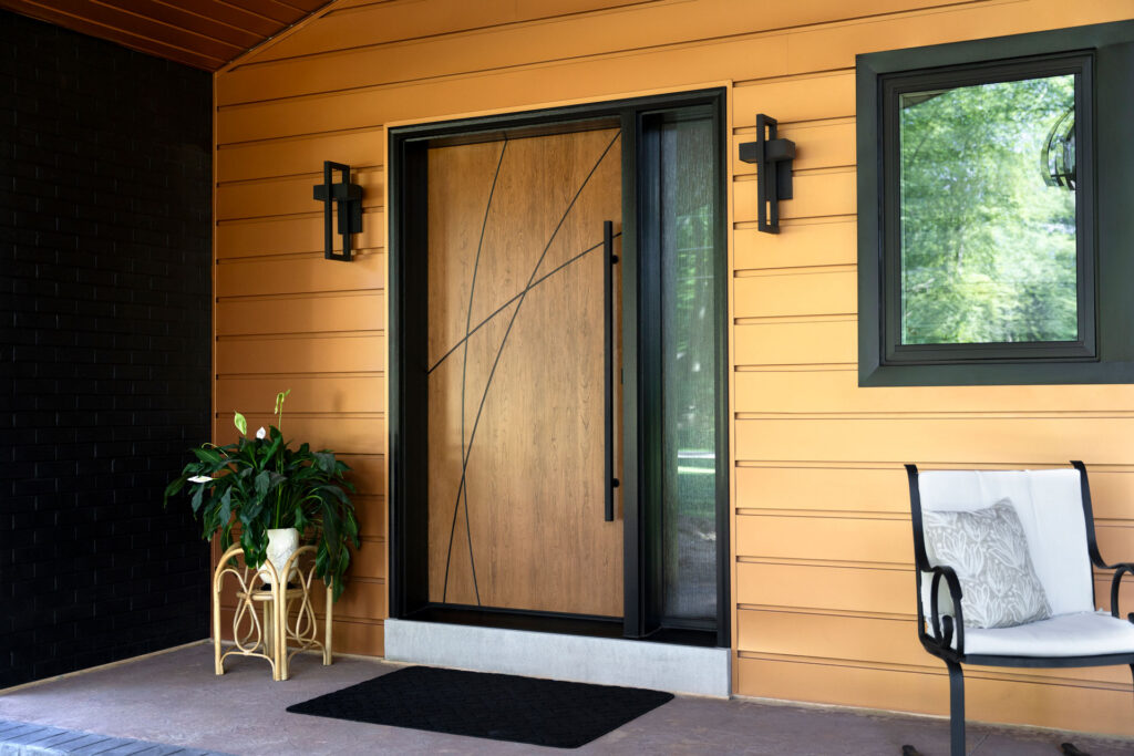 Signet inscribed entry door with waterfall privacy glass.