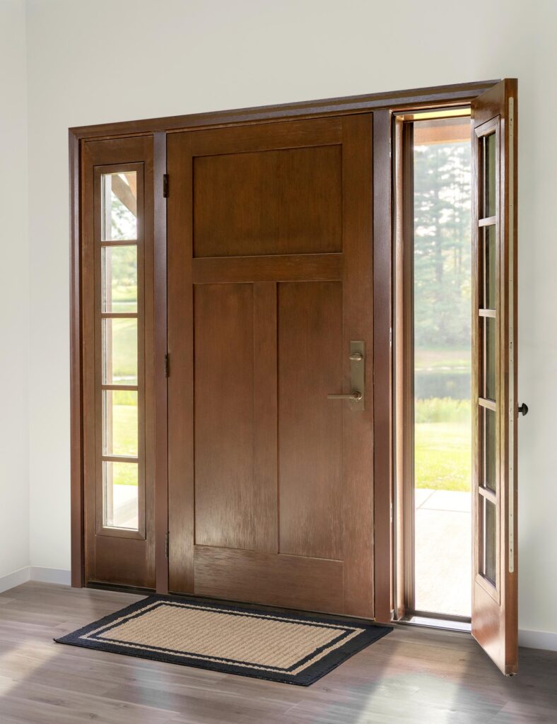 Woodgrain craftsman door with operable side lite.
