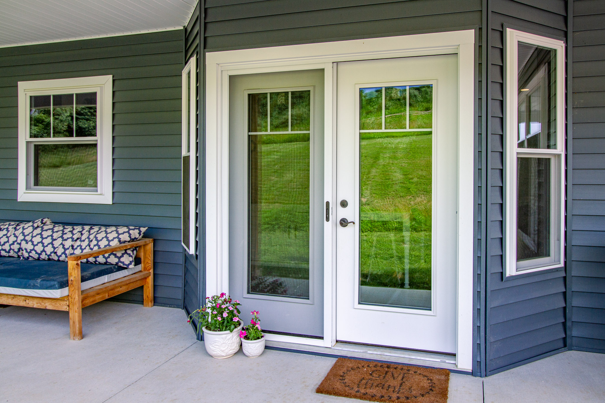 Signet hinged patio door in white.