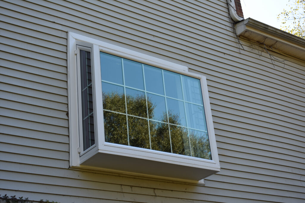 Large garden window with grids from the exterior.