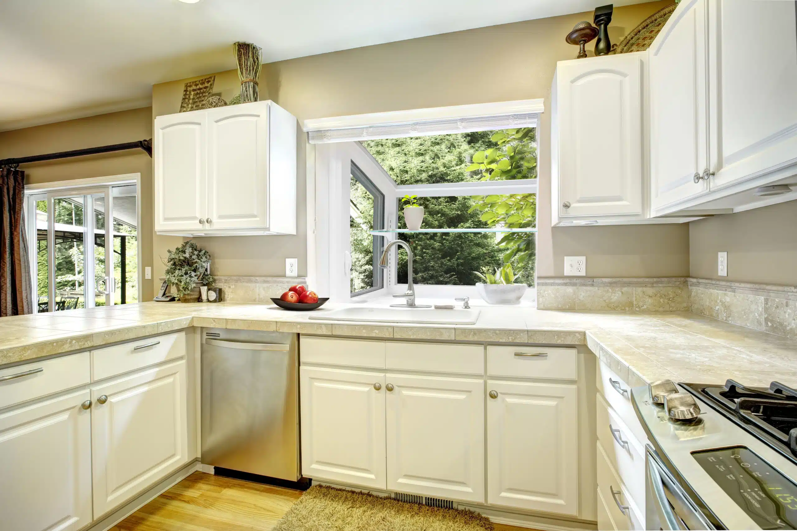 White garden window projecting from a kitchen